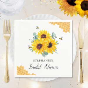 Bridal shower napkins with watercolor honeycomb, bees, sunflowers and eucalyptus foliage.