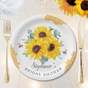 Bridal shower paper plates with watercolor honeycomb, bees, sunflowers and eucalyptus foliage.