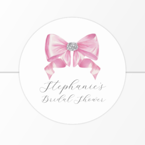 Shes tying the knot bridal shower coquette themed sticker featuring a chic glam silky pink bow with sparkling rhinestones design and customizable modern script typography.